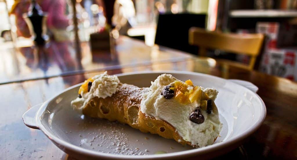 cannoli sitting on table during food tour