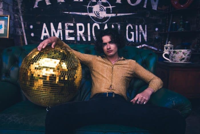 man with huge disco ball for virtual bartender party