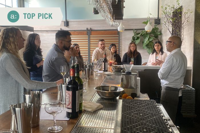 group standing around bar during private dining experience
