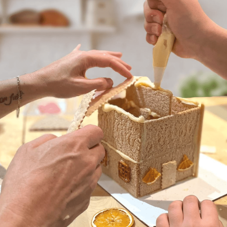 Edible Architecture. hands-working-on-charcuterie-chalet