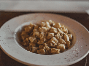 Gnocchi alla Gorganzola at Piazza pellegrini on a north beach food tour