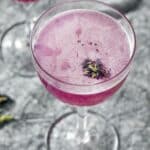 butterfly pea flower pink cocktail in a coupe glass