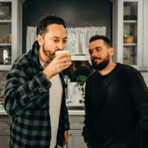 couple sipping cocktail during virtual happy hour event