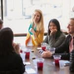 group sitting and drinking cocktails during sf food tour