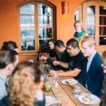 group of people seated at table during food tour