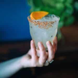 hand serving margarita during avital experience