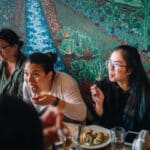 women sitting and eating during sf food tour