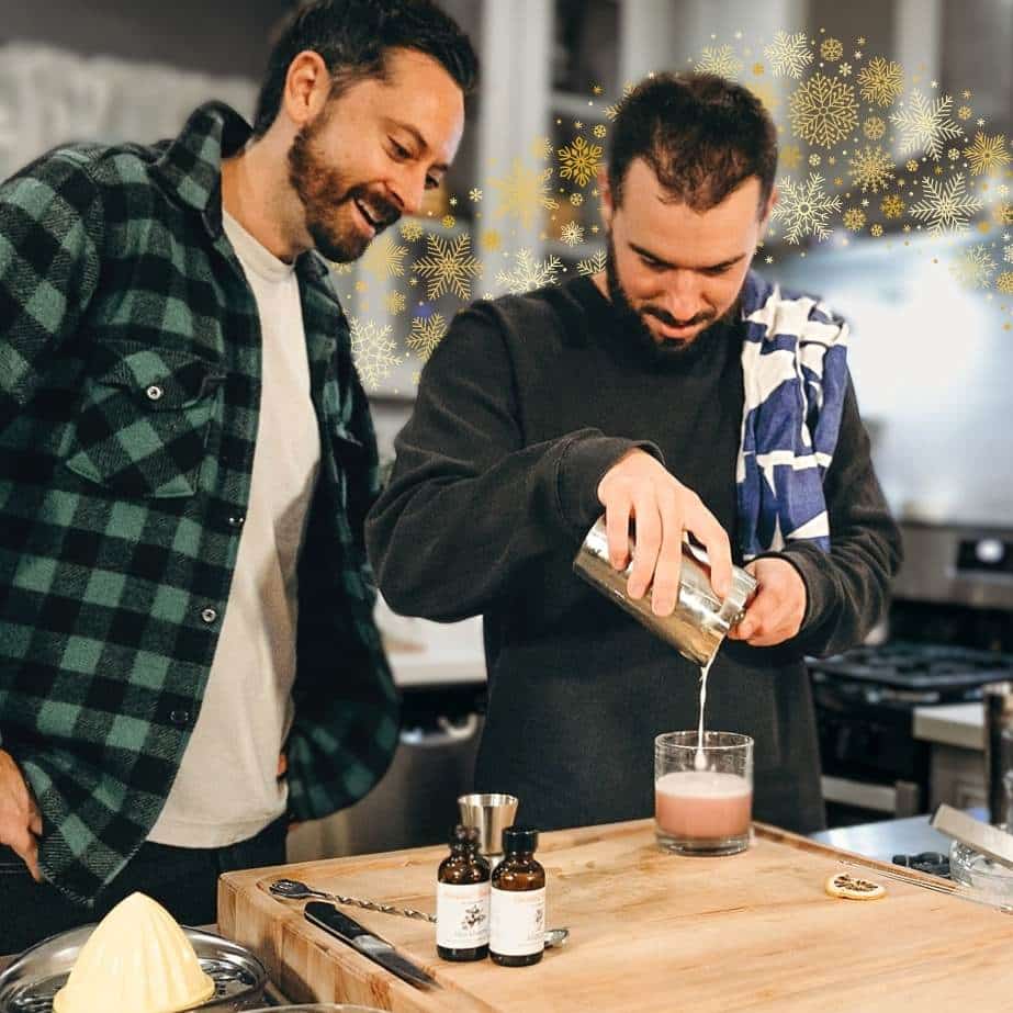 couple making cocktails is one of best virtual holiday party ideas