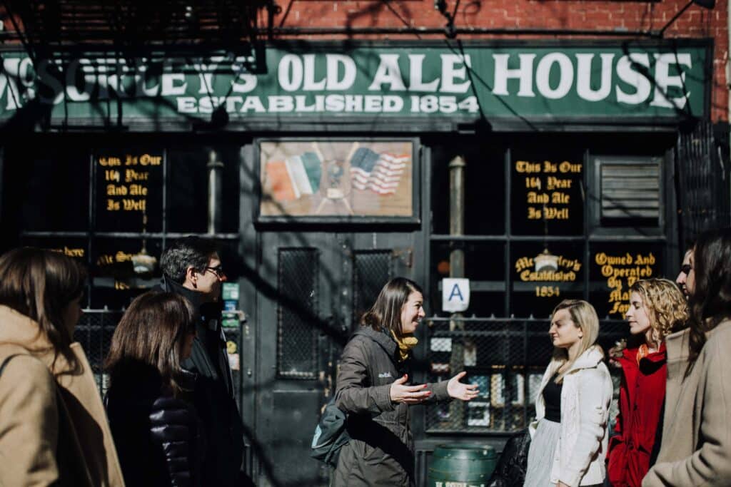 avital walking with tour guests during best nyc walking food tours 