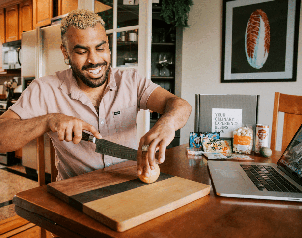 man cutting lemon during virtual halloween team building experience