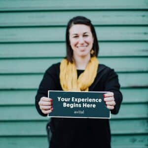 avital holding your experience begins here sign
