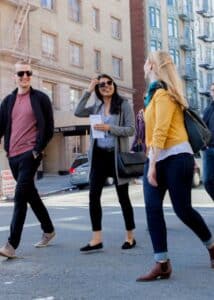 couple walking on street with avital guide during san francisco food tour