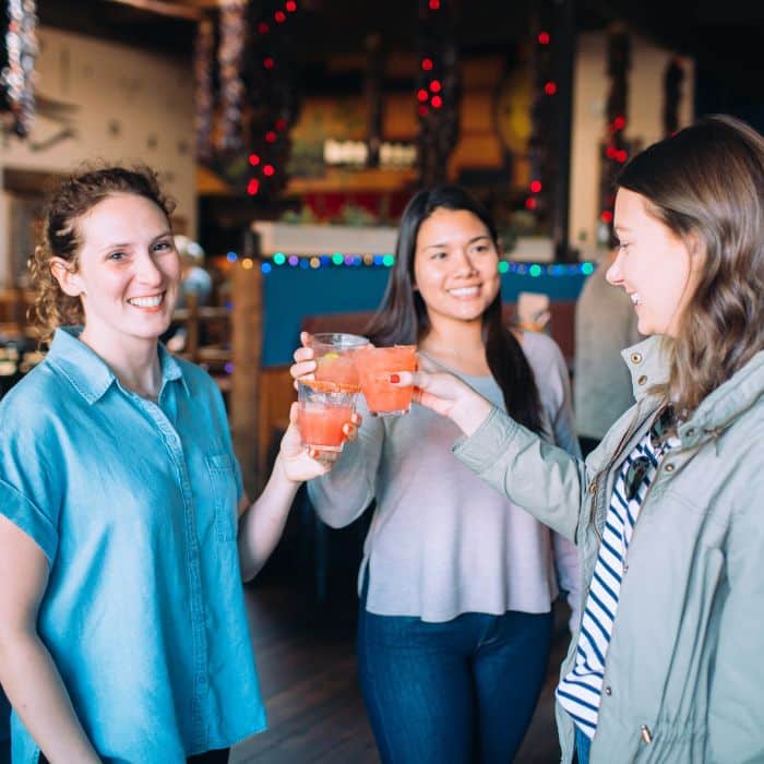 coworkers toasting cocktails during sf corporate team building event