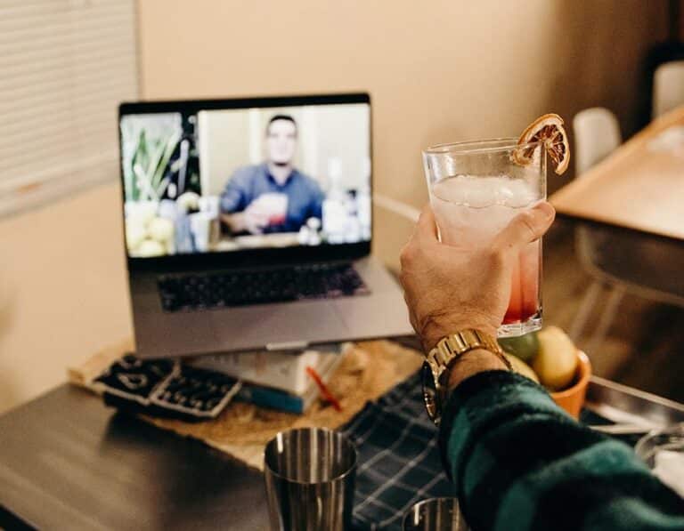 toasting cocktail at screen during virtual client entertainment event