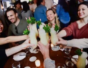 group toasting cocktails during nyc team building event