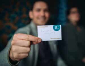 man holding up card during team building game