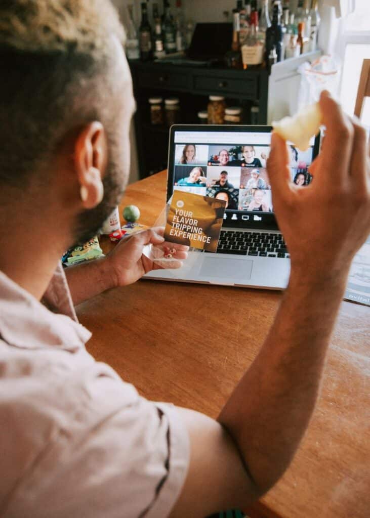 man looking at computer screen during virtual flavor experience