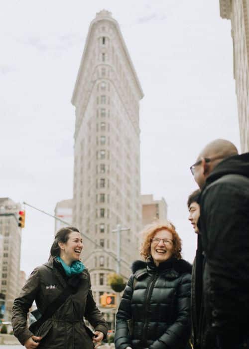 walking food tours in nyc group standing in front of flatiron building