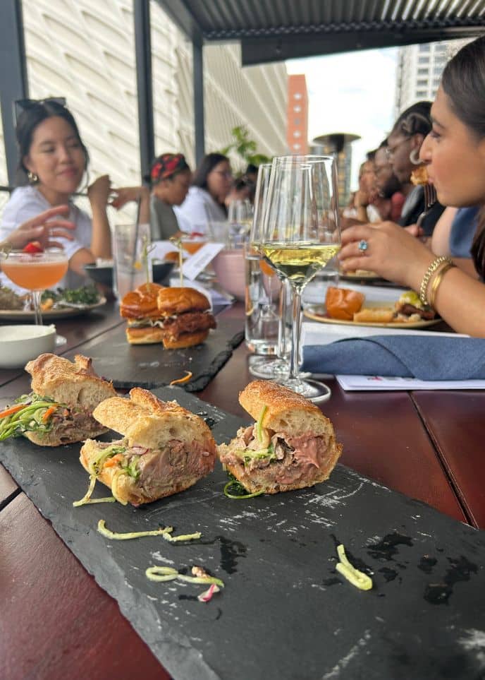 women eating during bachelorette party food tours in los angeles