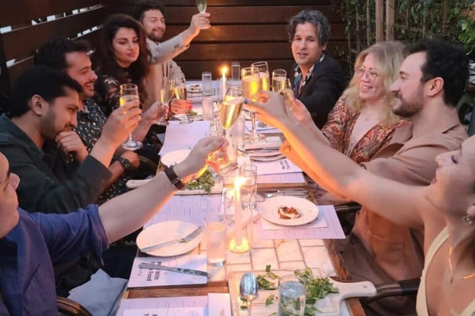 group toasting champagne during avital's interactive meal - choose one of the best restaurants with private rooms brooklyn