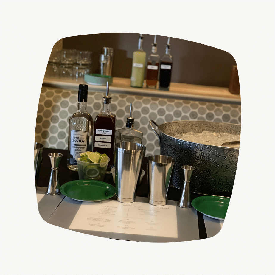 ingredients and tools set up at cocktail bar