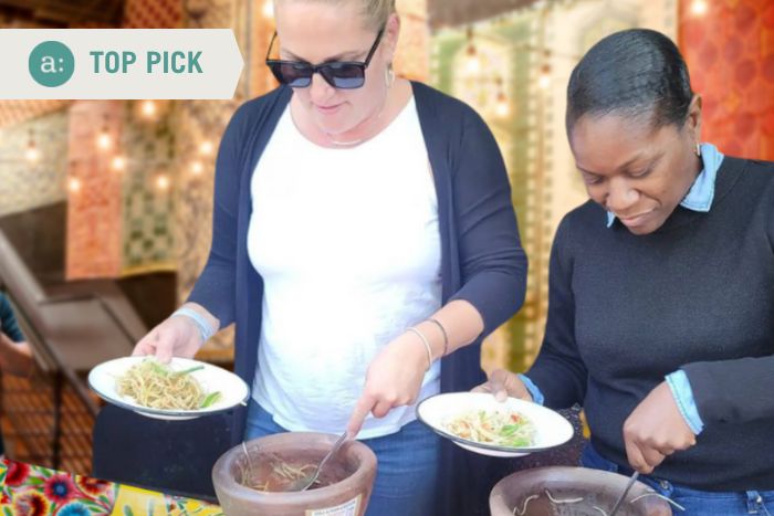 women-making-papaya-salad-during-hands-on-team-building-event