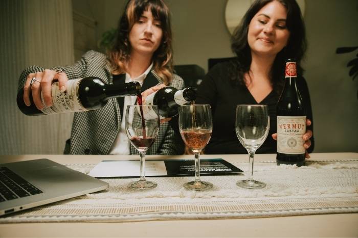 two women wine tasting during 40th birthday party
