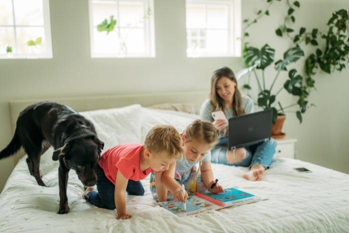 woman-working-from-home-with-children-and-dog