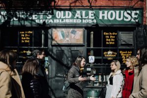 nyc scavenger hunt group stops in front of ale house