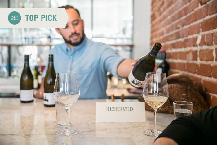 man-pouring-wine-during-experience-gifts-nyc