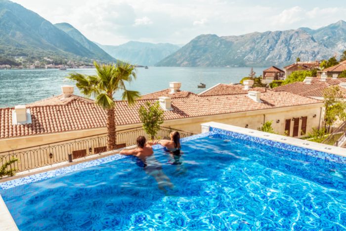 couple-in-pool-with-moutain-view