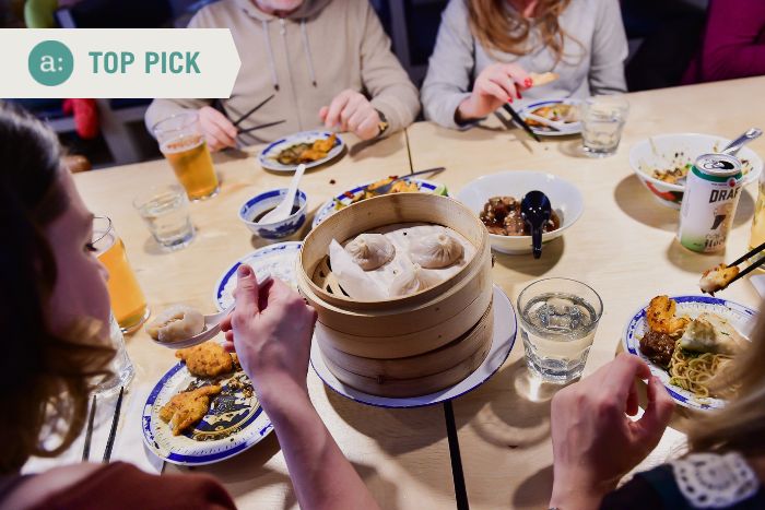 group-eating-dumplings-during-east-village-food-tour