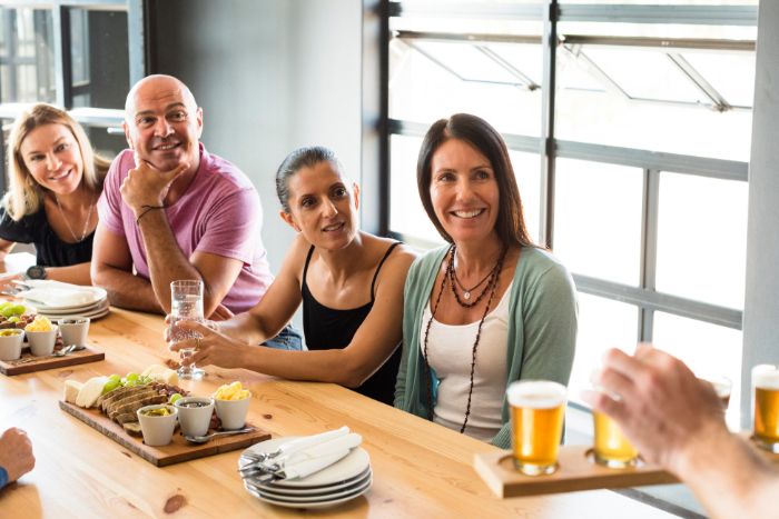 group of friends trying beers at brewery