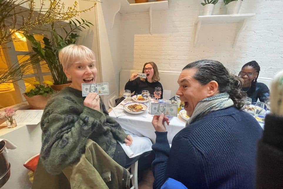 group holding fake money during birthday party celebration with avital