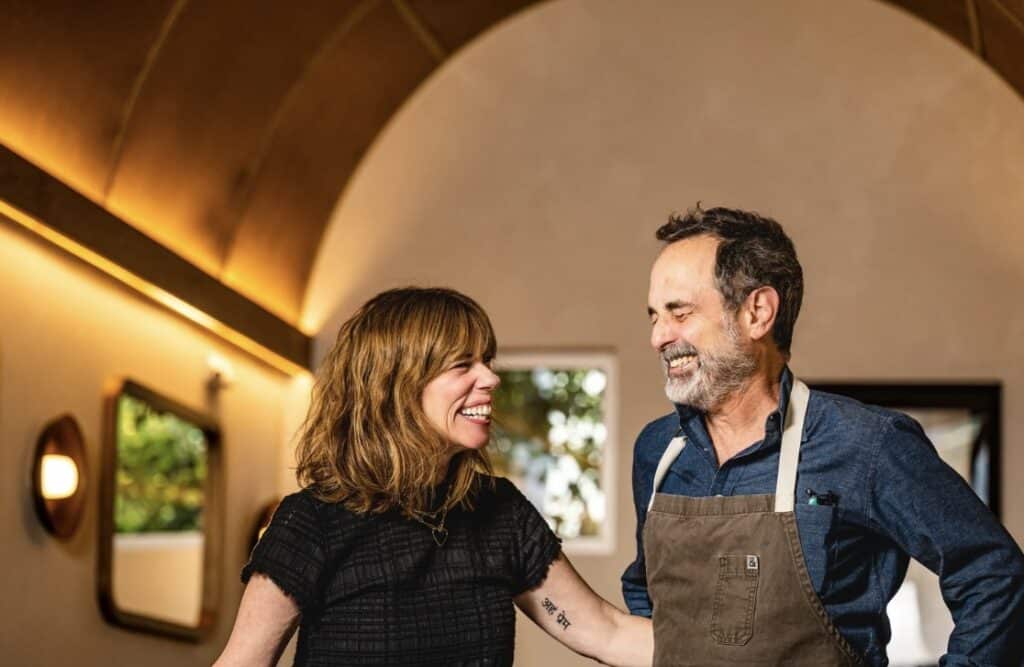 couple smiling at delfina in san francisco