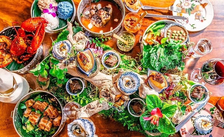 table full of vibrant food and farmhouse thai in san francisco