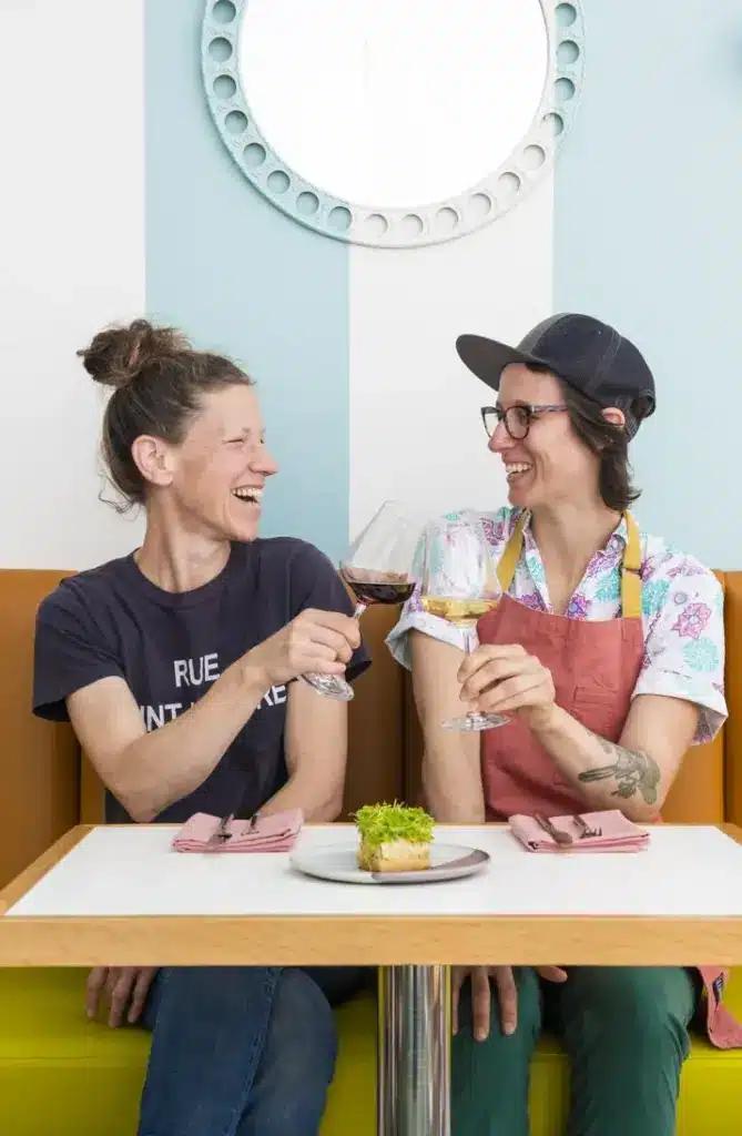 two women toasting wine at table at hilda and jesse in san francisco