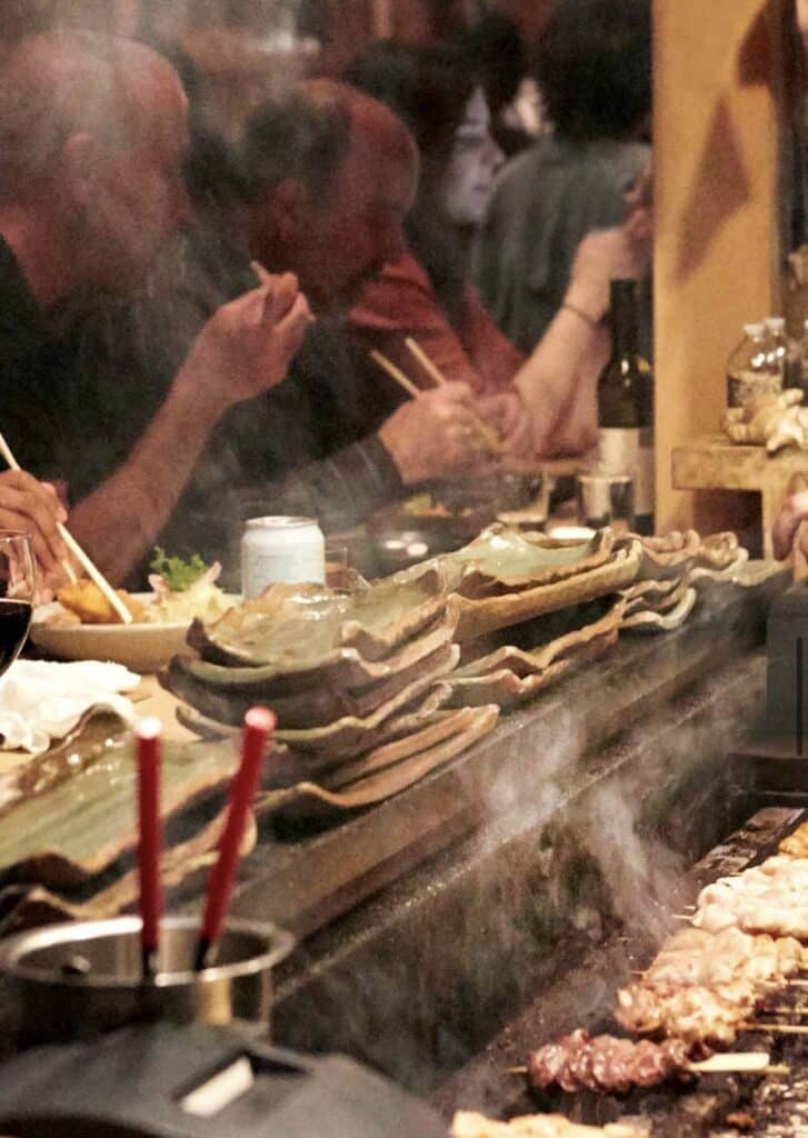 people eating at bar at rintaro