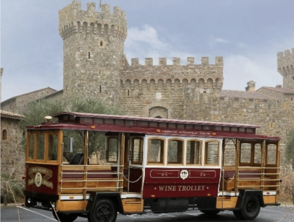 Napa Valley Wine Trolley picks up tour goers outside a castle