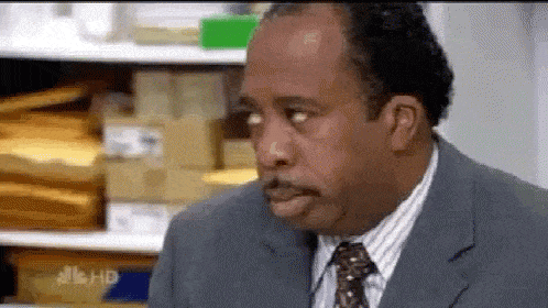 stanley from the office looking bored