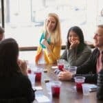 group sitting and drinking cocktails during sf food tour
