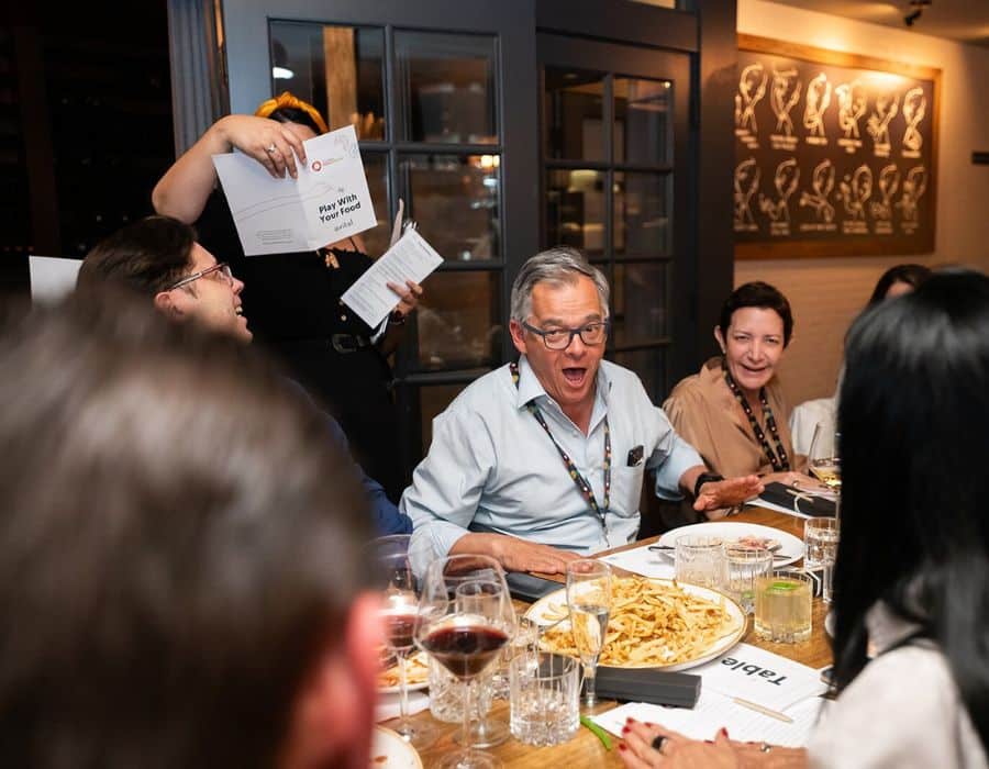 group laughing during trivia private dining