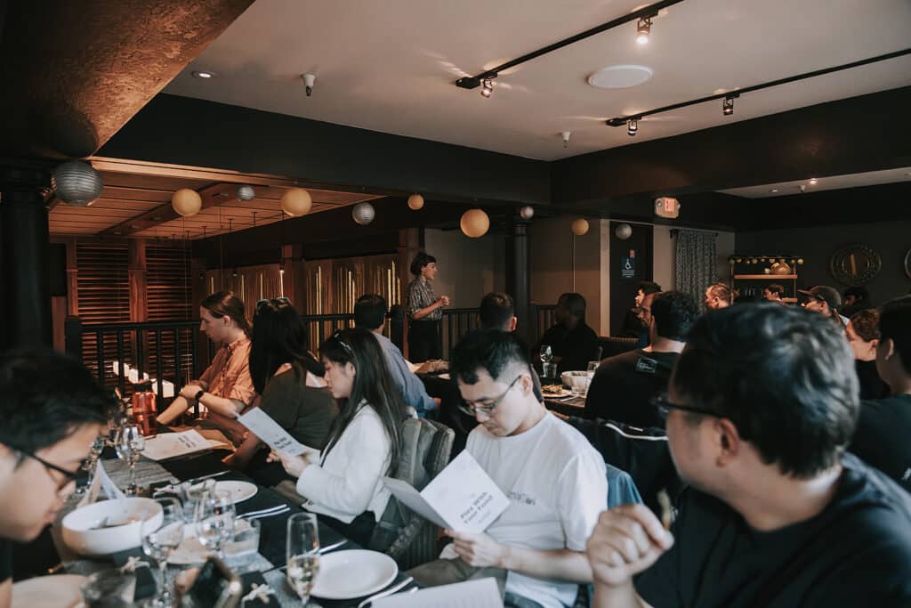 group looking at menus during avital interactive meal in san francisco