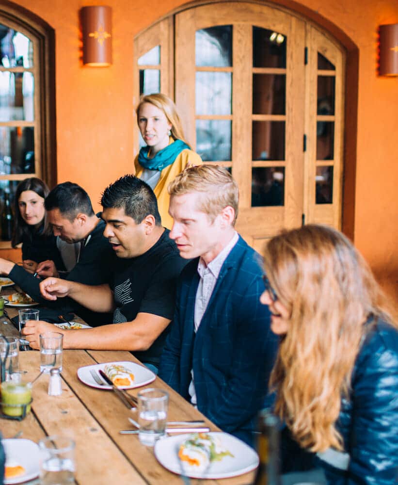 group eating during mission district food tour, on of best corporate holiday party ideas