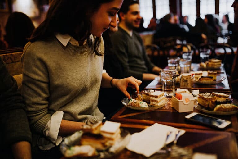 Dacia-Pierson.-East-Village-Food-Tour.-Guests-picking-up-pastry-to-eat-at-Veniero-copy