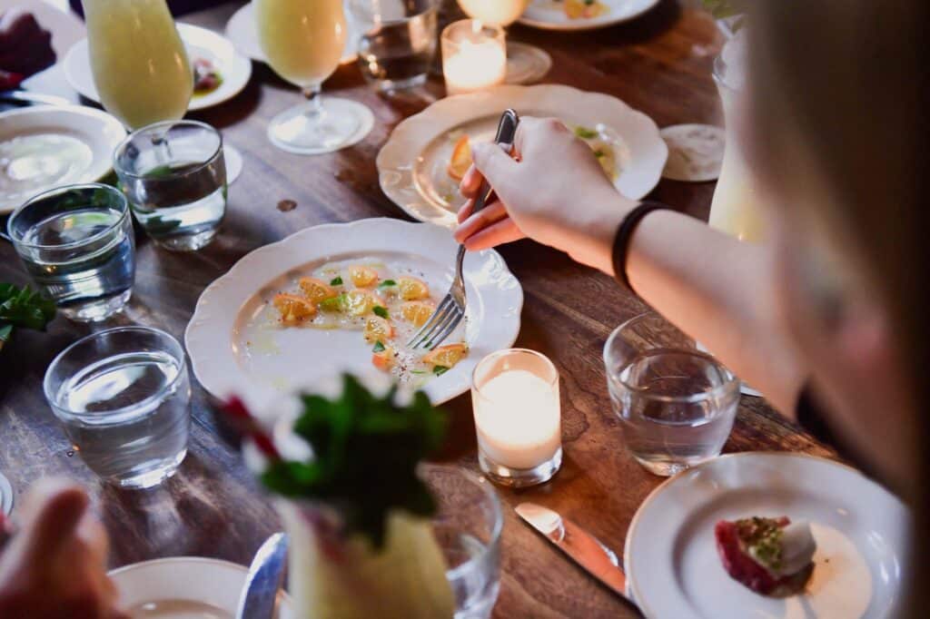 nyc corporate team building guest eating crudo at maison premiere