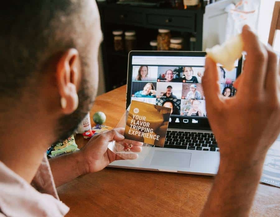 man on computer during virtual team building