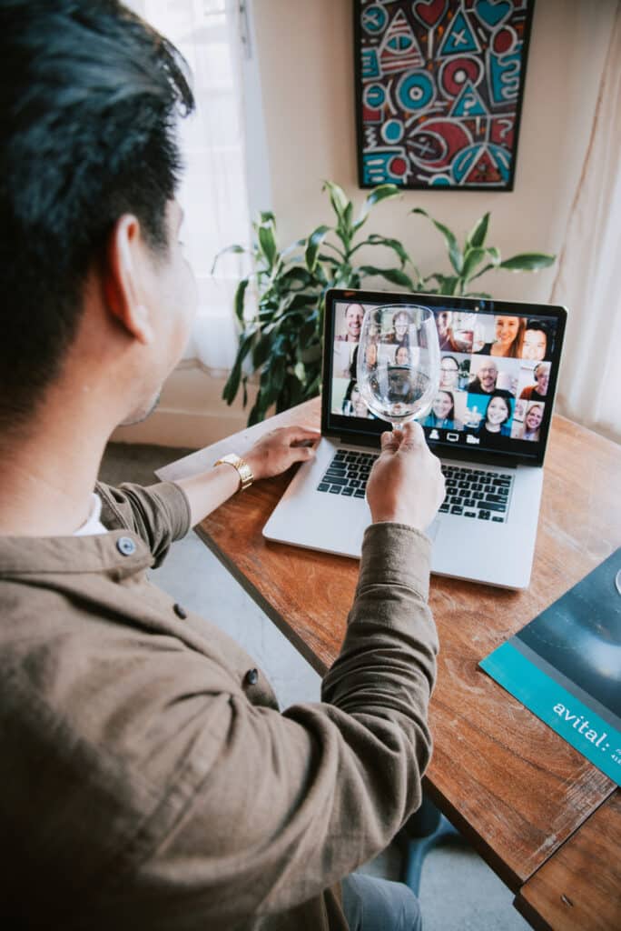 man toasting during virtual client entertainment event