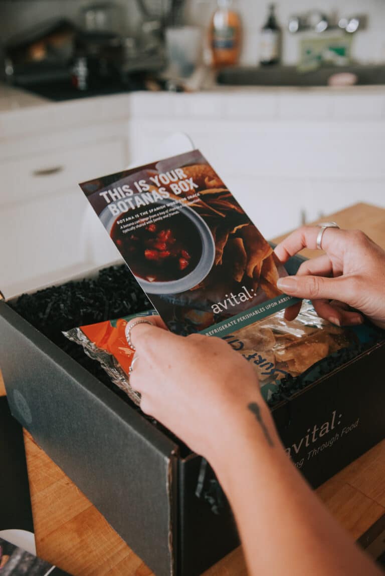 Opening Botanas Box Kit and holding welcome message paper insert