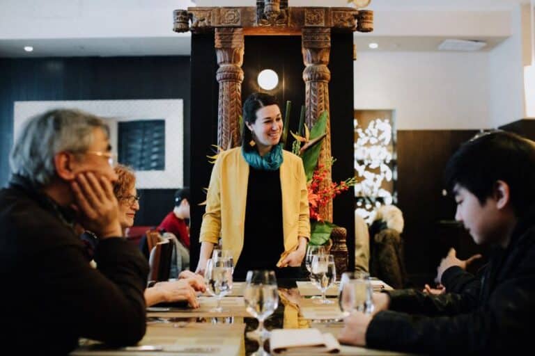 avital tour guide talking to guests during flatiron food tour